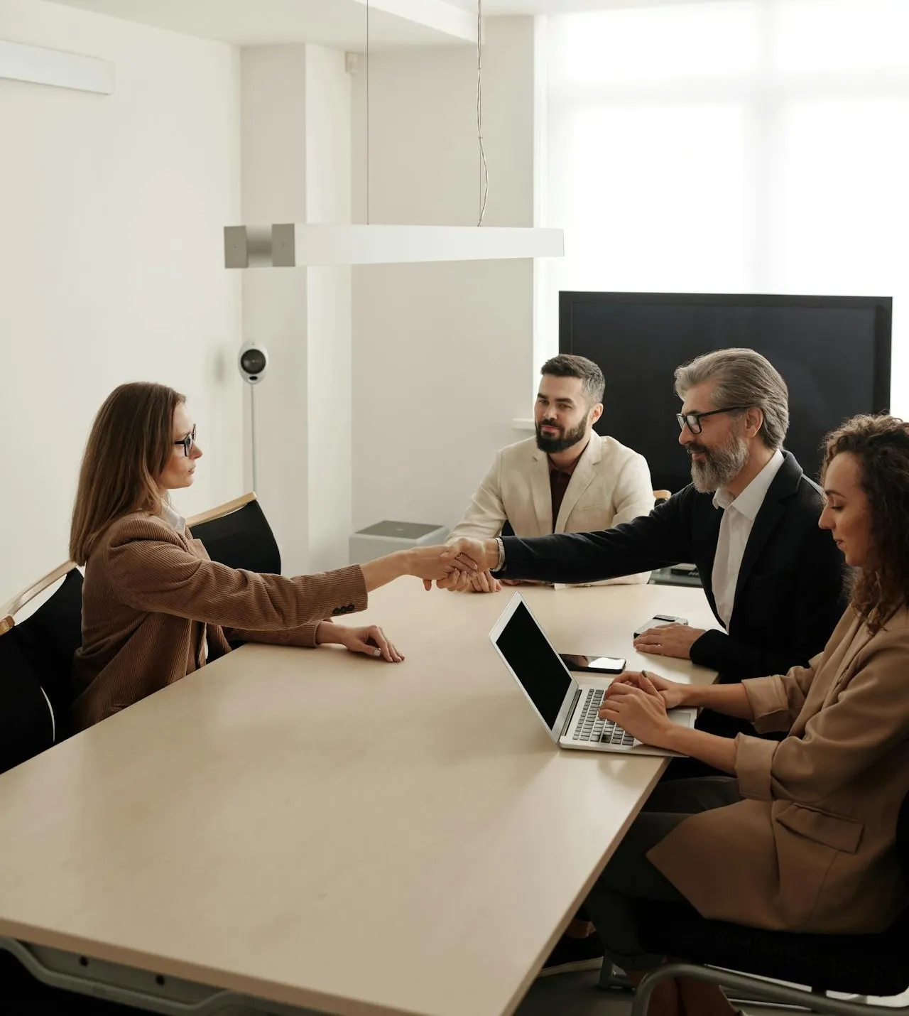 Business partners shaking hands.