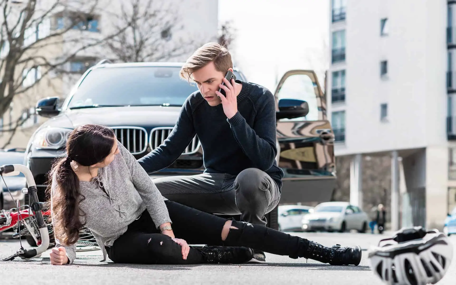 Biker injured in a car accident.